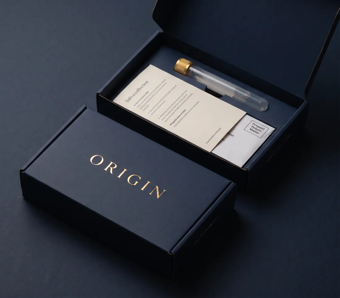 The ORIGIN kit: a navy box with a saliva tube and instructions